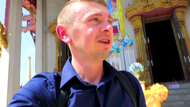Tourist visiting Wat Don Mueang Phra Arramluang temple Bangkok Thailand.