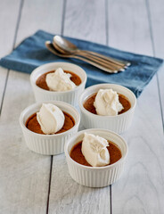 espresso and chocolate flavored pote de creme topped with whipped cream