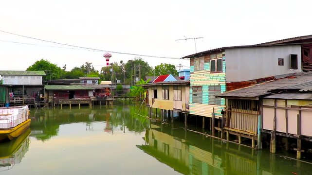 Life village houses along Prem Prachakon canal river Bangkok Thailand.