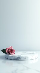 A vertical image of white round marble podium on the light grey background.