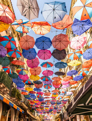 Umbrellas in a street near the Catania fish market on the island of Sicily.