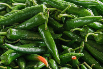 fresh green chilies selling at the dry market or fresh market fruit and vegetable stall