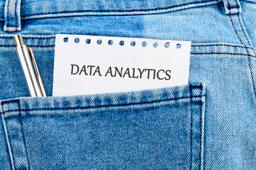The concept of technology and development. Phrase, words, text DATA ANALYTICS API It's written on a piece of paper in my jeans pocket