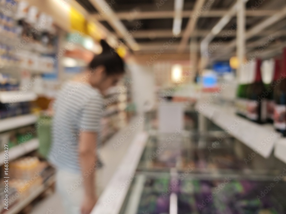 Poster abstract bokeh image of purple and white retail items create a blurred background.