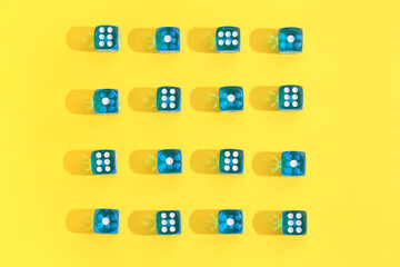 Blue game dices on yellow background