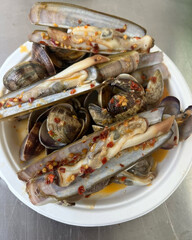 Plate of razor clams spiced with chili.