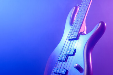 Modern electric guitar on colorful background
