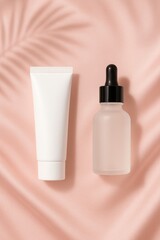 Cosmetic jar and frosted dropper bottle on pink silk