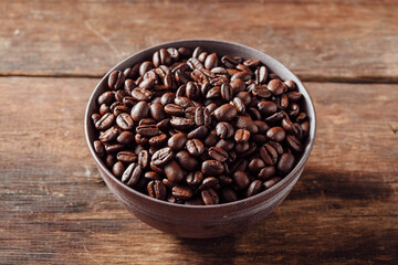 Freshly Roasted Coffee Beans in Rustic Bowl on Wooden Surface