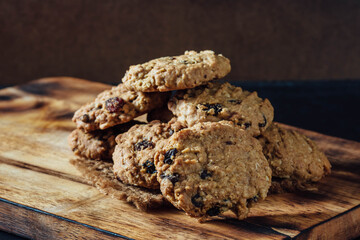 Freshly Baked Cookies on Wooden Board with Dark Background