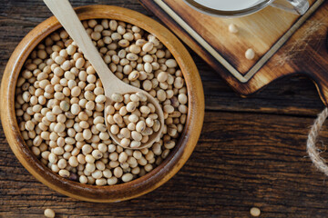 Fresh Organic Soybeans in Wooden Bowl with Spoon on Rustic Table