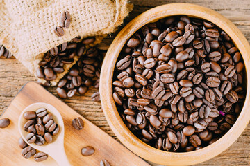 Freshly Roasted Coffee Beans in a Rustic Wooden Bowl and Spoon