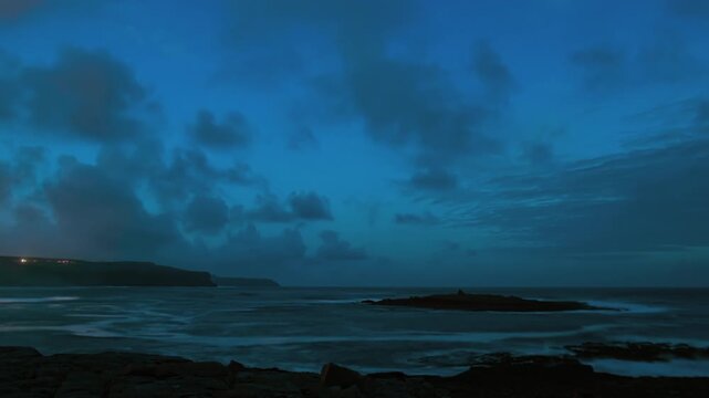 Evening timelapse of the Wild Atlantic Way, capturing the Cliffs of Moher and Crab Island as daylight fades
