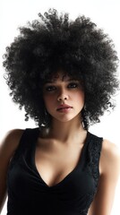 Fototapeta premium Beautiful Young Woman with a Stunning Afro Hairstyle Posing in a Black Top against a White Background