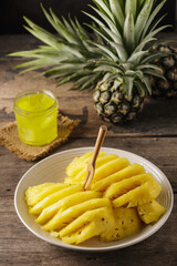 Freshly Sliced Pineapple with Pineapple Jelly on a Rustic Wood Table
