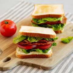 Homemade BLT (Bacon Lettuce Tomato)  Sandwich with Mayo, side view.