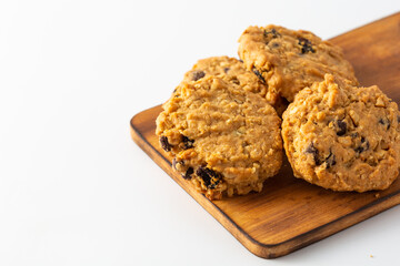 Freshly Baked Oatmeal Cookies with Chocolate Chips on Wooden Board