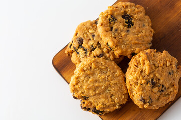 Freshly Baked Cookies on Wooden Cutting Board with White Background
