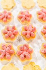 Flower Cookies with Decorative Raspberry Frosting