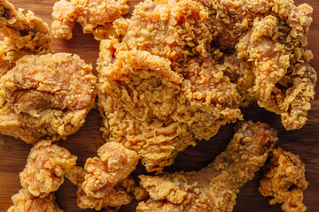Crispy Fried Chicken Pieces on a Wooden Surface for Delicious Meal