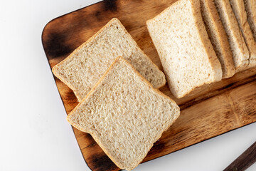 Slices of Fresh Whole Wheat Bread on Wooden Cutting Board
