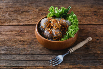 Fresh and Delicious Dish Served in Bowl with Greens on Rustic Table