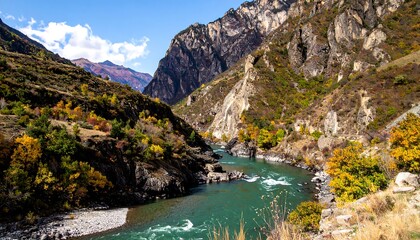 Autumnal river gorge with dramatic mountains