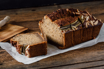Freshly Baked Banana Bread with Almonds on Rustic Wooden Table