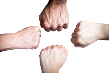 Group of hands joining in strength. A group of four fists joined together in a gesture of teamwork, strength, and unity. Partnership, success, support, community, cooperation, group, power, people