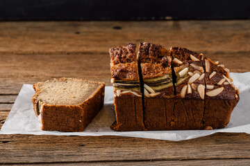 Deliciously Sliced Bread Loaf with Almonds on Rustic Wooden Surface