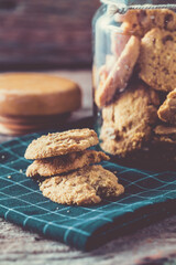 Freshly Baked Cookies with Jar on Wooden Background