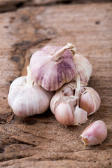 Fresh Garlic Bulbs and Cloves on Wooden Surface for Culinary Use