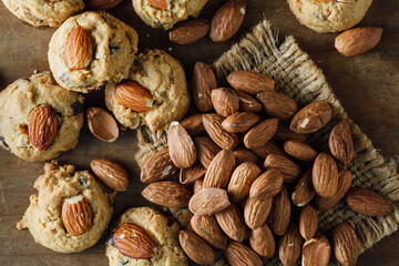Fresh Baked Cookies with Almonds on Rustic Wooden Surface