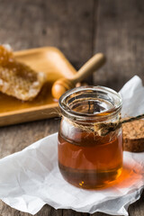 Sweet Honey in Jar with Natural Ingredients and Rustic Background