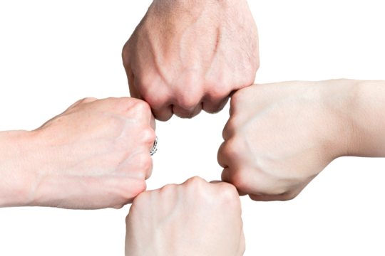 Group of hands joining in strength. A group of four fists joined together in a gesture of teamwork, strength, and unity. Business, team, partnership, success, support, community, cooperation, power