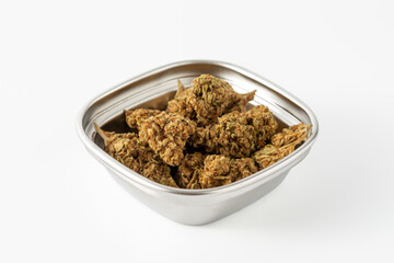 Freshly Harvested Green Cannabis Buds in Silver Bowl on White Background