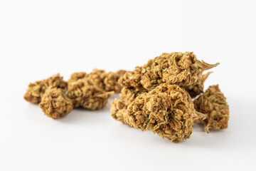 Close-Up of Dried Cannabis Flower Buds on White Background