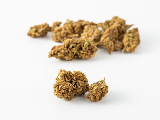 Close-Up of Dried Cannabis Buds on White Background for Health Use