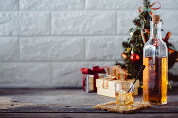 Festive Setting with Glass of Whiskey and Christmas Decorations