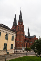 Uppsala, Sweden - 2 October 2022: Uppsala Cathedral in autumn with grey sky