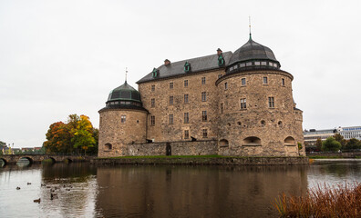 OREBRO, SWEDEN - 2 October 2022: The castle of Orebro is a medieval stone building, which is one of the most famous and historically significant castles of the Kingdom of Sweden in autumn