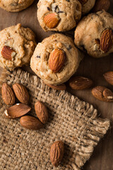 Fresh Almond Cookies on Rustic Wood Background with Almonds