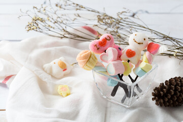 Colorful Marshmallow Treats with Cute Designs and Natural Decor