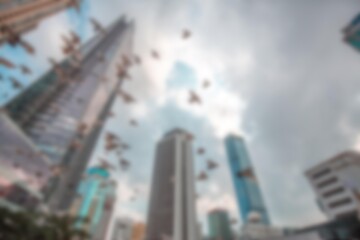 Blurred view of skyscrapers in Shenzhen, China, from a shopping mall, the sky filled with abstract bokeh.