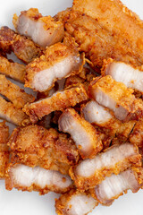 Crispy Fried Pork Belly Slices Served on a White Plate
