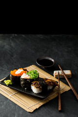 Delicious Sushi Platter with Assorted Rolls on Dark Background