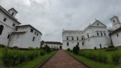 Fototapeta premium Exterior View of Se’ Cathedral de Santa Catarina in Old Goa under a Cloudy Sky