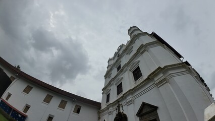 Church and Convent of St. Francis of Assisi in Old Goa, showcasing colonial Portuguese architecture under cloudy skies