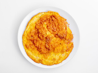Golden Brown Omelette on White Plate Isolated on Light Background