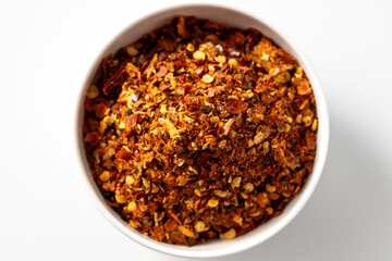 Bowl of Spicy Red Chili Flakes Seasoning for Culinary Use